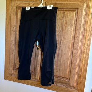 Lululemon size 8 women’s workout capris with mesh on side. Great condition.